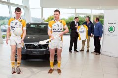 Mark Sugrue and James O'Donovan practice their ball skills while Justin Galvin [MD Finbarr Galvins] chats with Denis Lucey[Chairman Bandon GAA] and Don Desmond [Secretary Bandon GAA]